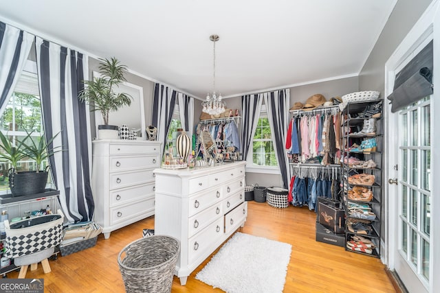 1101 Cherokee Dr, Waycross, GA 31501 - spacious closet featuring a chandelier and light wood-type flooring