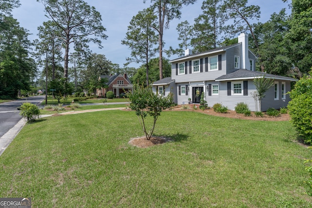 1101 Cherokee Dr, Waycross, GA 31501 - view of front of house featuring a chimney and a front lawn