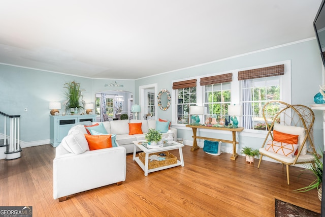 1101 Cherokee Dr, Waycross, GA 31501 - living room featuring ornamental molding, wood finished floors, stairway, and baseboards