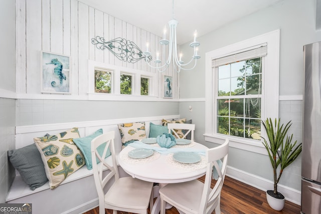 1101 Cherokee Dr, Waycross, GA 31501 - dining room with a chandelier, breakfast area, baseboards, and wood finished floors