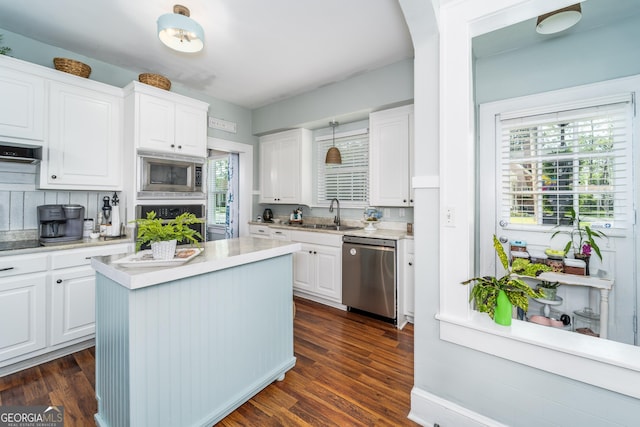 1101 Cherokee Dr, Waycross, GA 31501 - kitchen with appliances with stainless steel finishes, a sink, white cabinetry, and light countertops