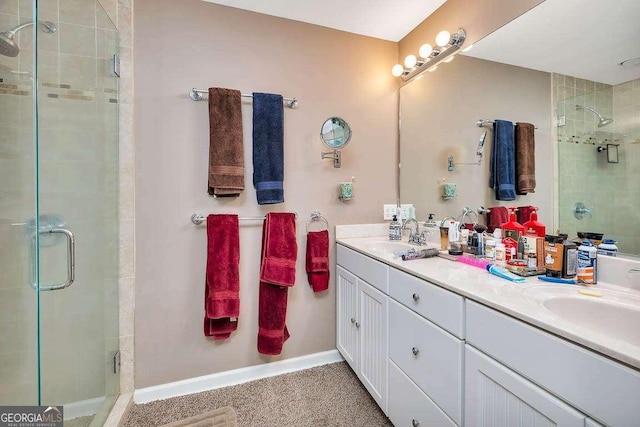 503 Marsh Cir, Saint Simons, GA 31522 - full bathroom with a shower stall, double vanity, and baseboards