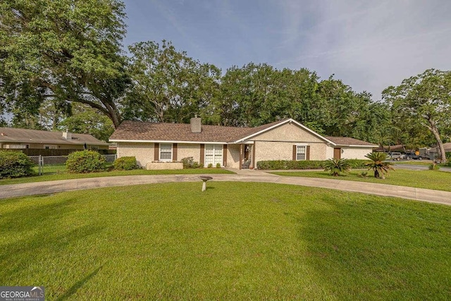 503 Marsh Cir, Saint Simons, GA 31522 - ranch-style home with a chimney and concrete driveway