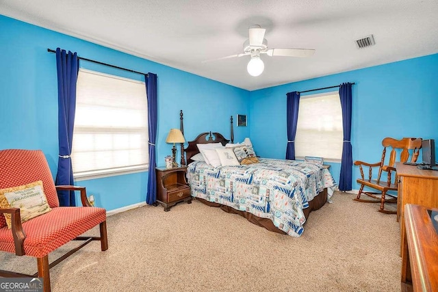 503 Marsh Cir, Saint Simons, GA 31522 - carpeted bedroom with baseboards and a ceiling fan