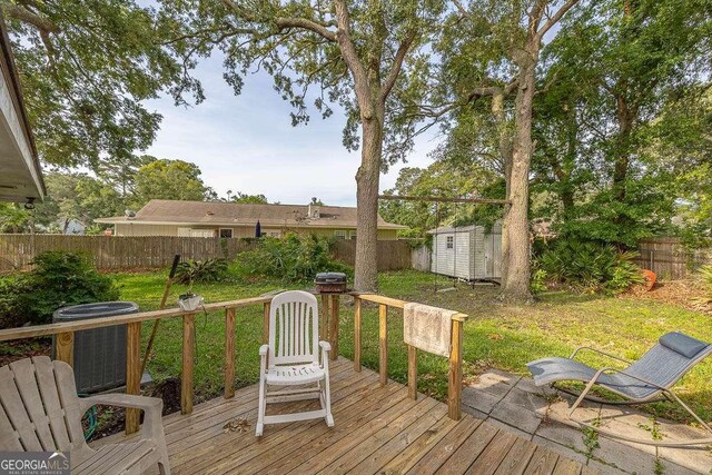 503 Marsh Cir, Saint Simons, GA 31522 - wooden deck featuring central AC