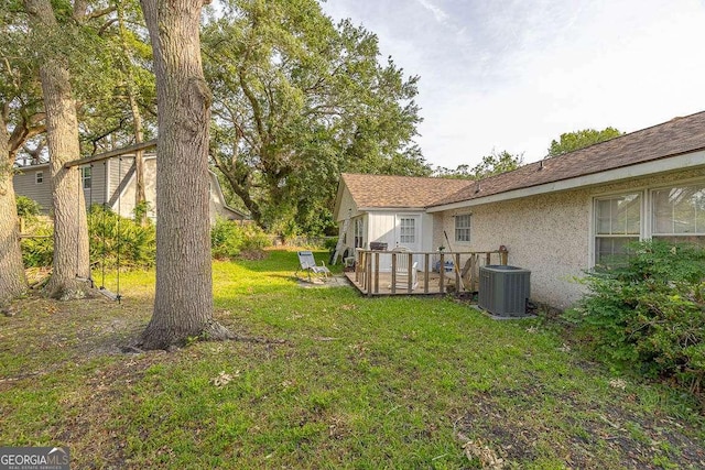 503 Marsh Cir, Saint Simons, GA 31522 - view of grassy yard featuring central AC unit