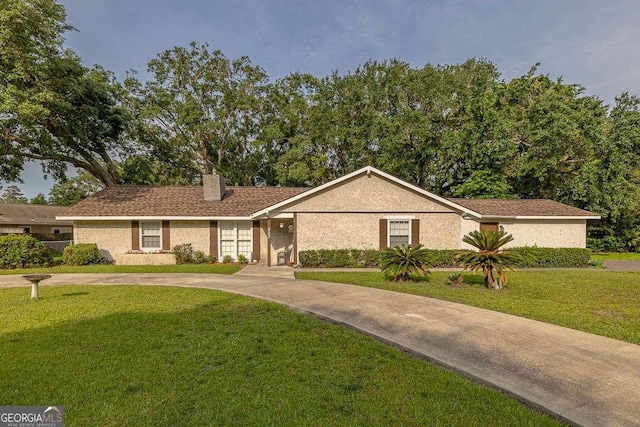 503 Marsh Cir, Saint Simons, GA 31522 - view of front of property featuring a front lawn and a chimney