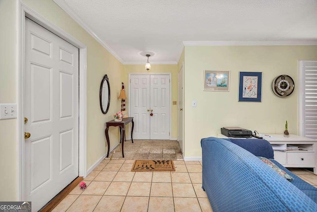 503 Marsh Cir, Saint Simons, GA 31522 - foyer featuring light tile patterned floors, crown molding, and baseboards