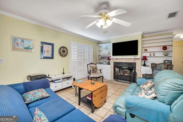 503 Marsh Cir, Saint Simons, GA 31522 - living area featuring ornamental molding, a ceiling fan, light tile patterned floors, a fireplace, and a textured ceiling