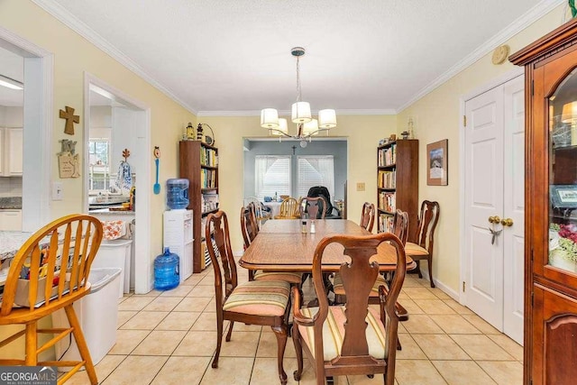 503 Marsh Cir, Saint Simons, GA 31522 - dining room featuring a chandelier, ornamental molding, and light tile patterned floors