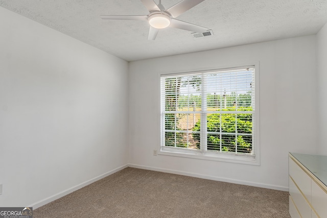 14 Winter Ln, Newnan, GA 30265 - unfurnished room with baseboards, light colored carpet, a textured ceiling, and a ceiling fan