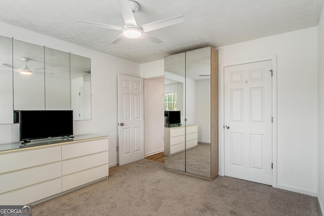 14 Winter Ln, Newnan, GA 30265 - unfurnished bedroom with light carpet, a ceiling fan, and baseboards