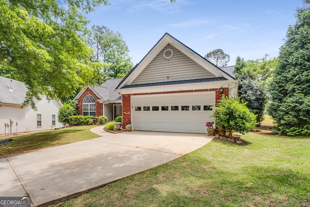 14 Winter Ln, Newnan, GA 30265 - view of front facade featuring brick siding, driveway, a garage, a shingled roof, and a front lawn