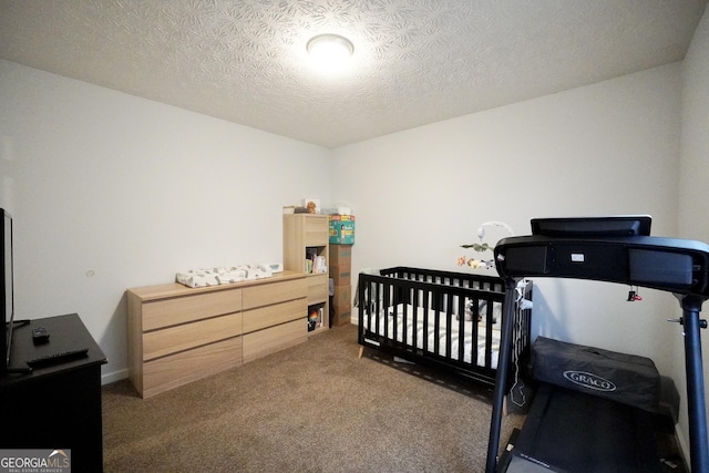 carpeted bedroom with a textured ceiling