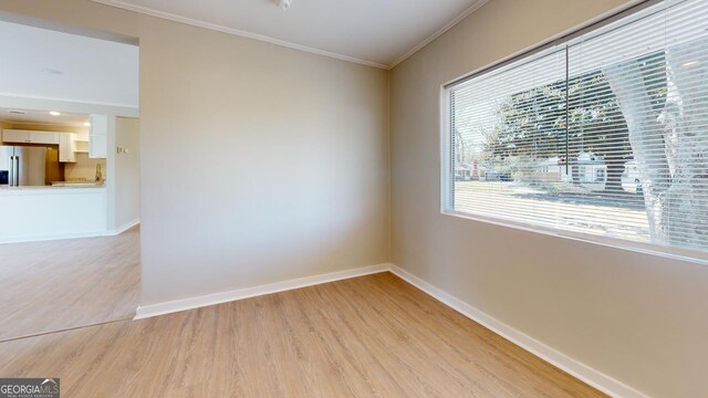 2280 Raleigh Dr, Augusta, GA 30904 - empty room featuring light wood-style floors, baseboards, and crown molding