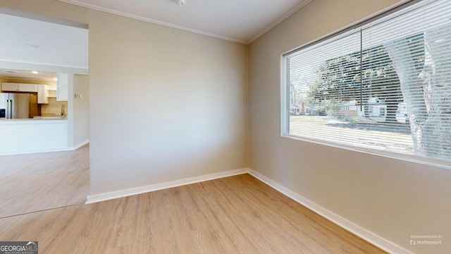 2280 Raleigh Dr, Augusta, GA 30904 - spare room with light wood-style flooring, crown molding, and baseboards