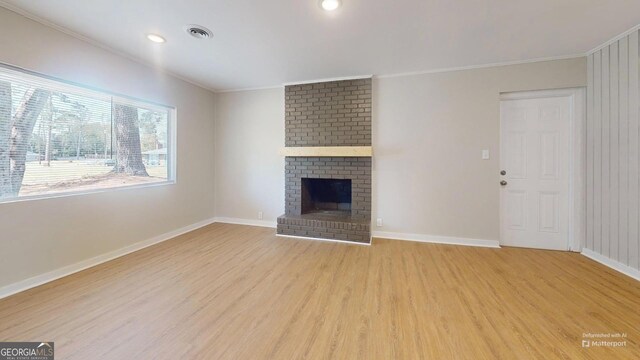 2280 Raleigh Dr, Augusta, GA 30904 - unfurnished living room featuring light wood-type flooring, ornamental molding, baseboards, a fireplace, and recessed lighting