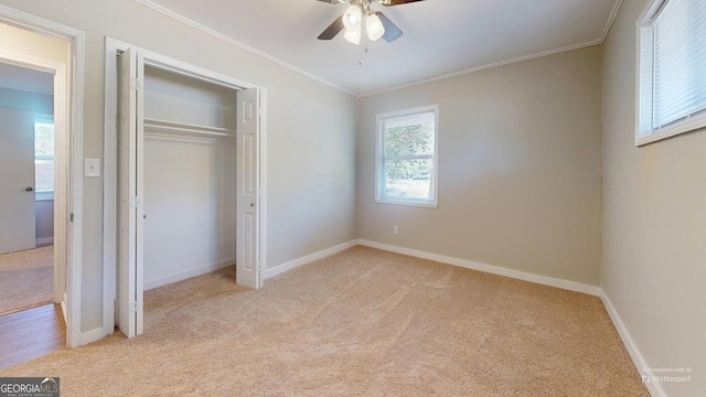 2280 Raleigh Dr, Augusta, GA 30904 - unfurnished bedroom with light colored carpet, crown molding, baseboards, a closet, and ceiling fan