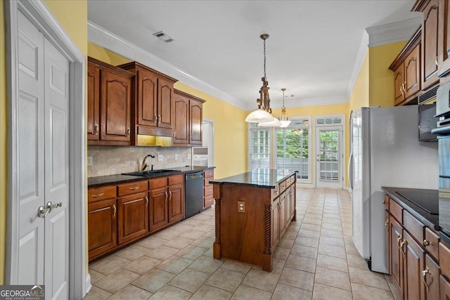 1253 Oakwood Pl, Loganville, GA 30052 - kitchen with black appliances, a sink, crown molding, backsplash, and a center island