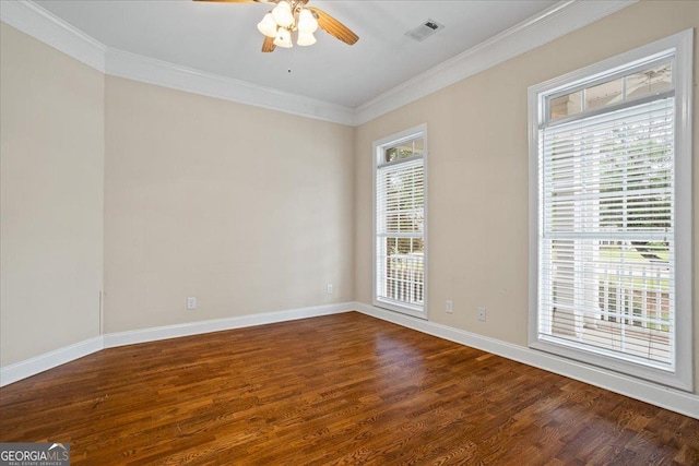 1253 Oakwood Pl, Loganville, GA 30052 - empty room with ornamental molding, wood finished floors, a ceiling fan, and baseboards