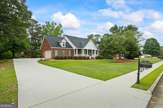 1253 Oakwood Pl, Loganville, GA 30052 - view of front facade featuring a front lawn, brick siding, driveway, an attached garage, and covered porch