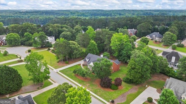 1253 Oakwood Pl, Loganville, GA 30052 - aerial view of residential area with a heavily wooded area