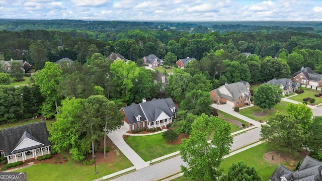 1253 Oakwood Pl, Loganville, GA 30052 - aerial view of residential area featuring a heavily wooded area
