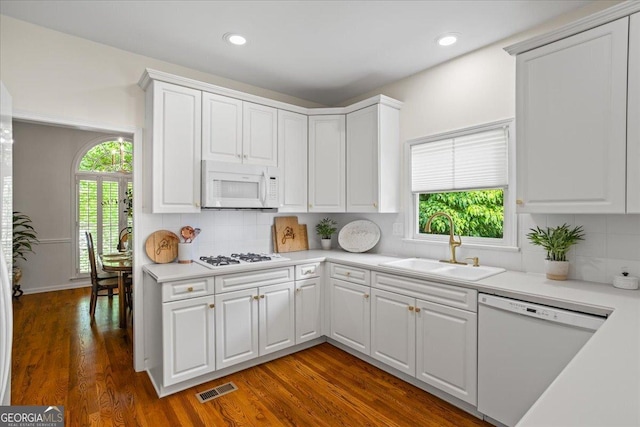 1444 Merrifield Ln, Marietta, GA 30062 - kitchen featuring white appliances, a sink, light countertops, plenty of natural light, and recessed lighting