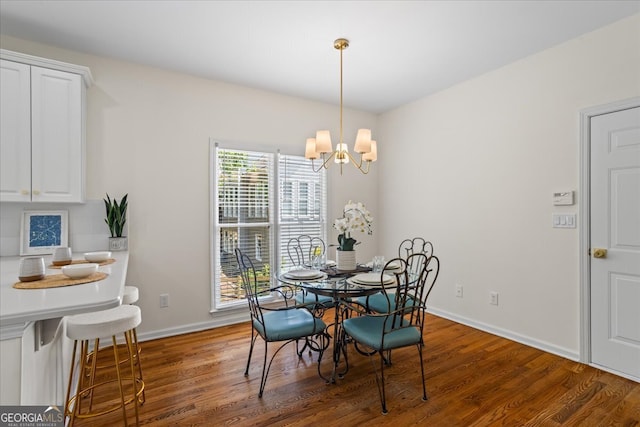 1444 Merrifield Ln, Marietta, GA 30062 - dining room featuring a chandelier, wood finished floors, and baseboards