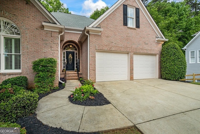 1444 Merrifield Ln, Marietta, GA 30062 - view of front facade with concrete driveway, a garage, brick siding, and roof with shingles