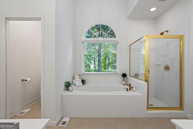 1444 Merrifield Ln, Marietta, GA 30062 - bathroom featuring a stall shower, a bath, and tile patterned flooring