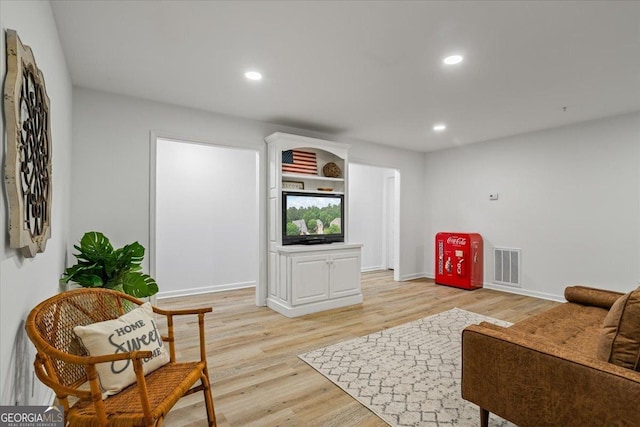 1444 Merrifield Ln, Marietta, GA 30062 - living area featuring light wood finished floors, recessed lighting, and baseboards