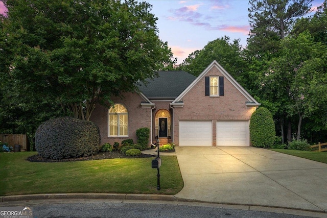 1444 Merrifield Ln, Marietta, GA 30062 - traditional-style house featuring concrete driveway, a front lawn, a garage, and brick siding