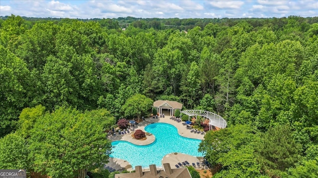 1444 Merrifield Ln, Marietta, GA 30062 - aerial view of a heavily wooded area and a pool area
