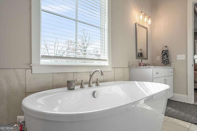 1325 Silo Bnd, Watkinsville, GA 30677 - bathroom with a freestanding tub, vanity, and tile patterned floors