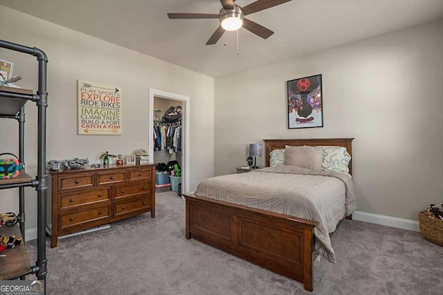 1325 Silo Bnd, Watkinsville, GA 30677 - bedroom featuring carpet floors, a walk in closet, a closet, ceiling fan, and baseboards