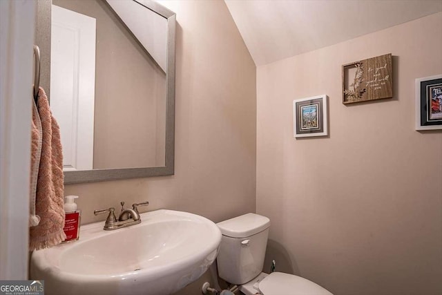 1325 Silo Bnd, Watkinsville, GA 30677 - half bath with a sink, toilet, and lofted ceiling