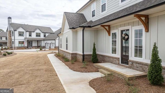 1325 Silo Bnd, Watkinsville, GA 30677 - entrance to property with board and batten siding and a shingled roof