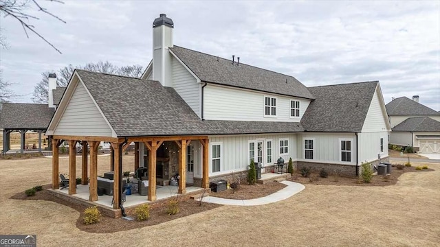 1325 Silo Bnd, Watkinsville, GA 30677 - back of house featuring a patio, roof with shingles, board and batten siding, and cooling unit