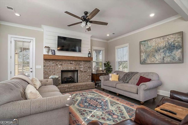 1325 Silo Bnd, Watkinsville, GA 30677 - living area with ceiling fan, ornamental molding, baseboards, wood finished floors, and a brick fireplace