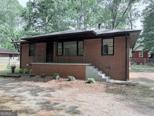 view of front of house with brick siding