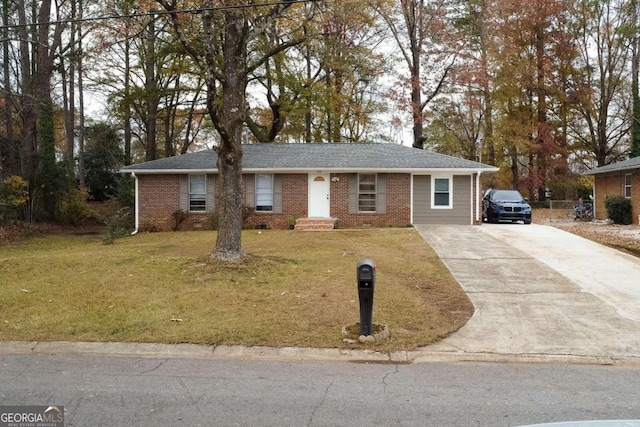 single story home with concrete driveway, a front yard, brick siding, and a shingled roof