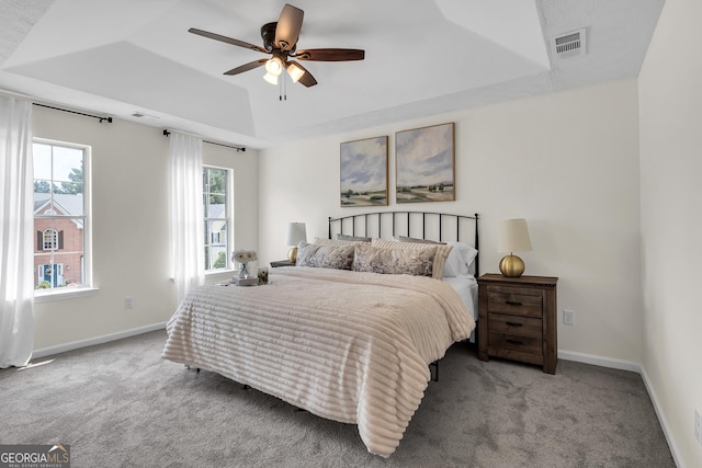 1075 Litchfield Way SW, Marietta, GA 30060 - carpeted bedroom with a raised ceiling, baseboards, and a ceiling fan