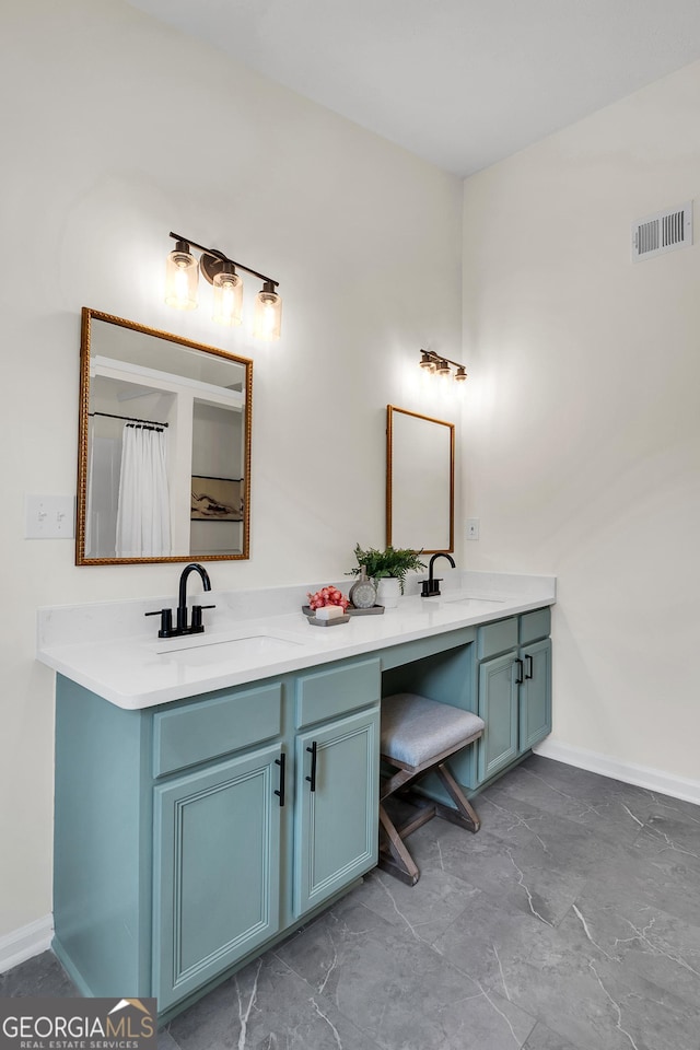 1075 Litchfield Way SW, Marietta, GA 30060 - bathroom featuring double vanity, baseboards, and marble finish floors