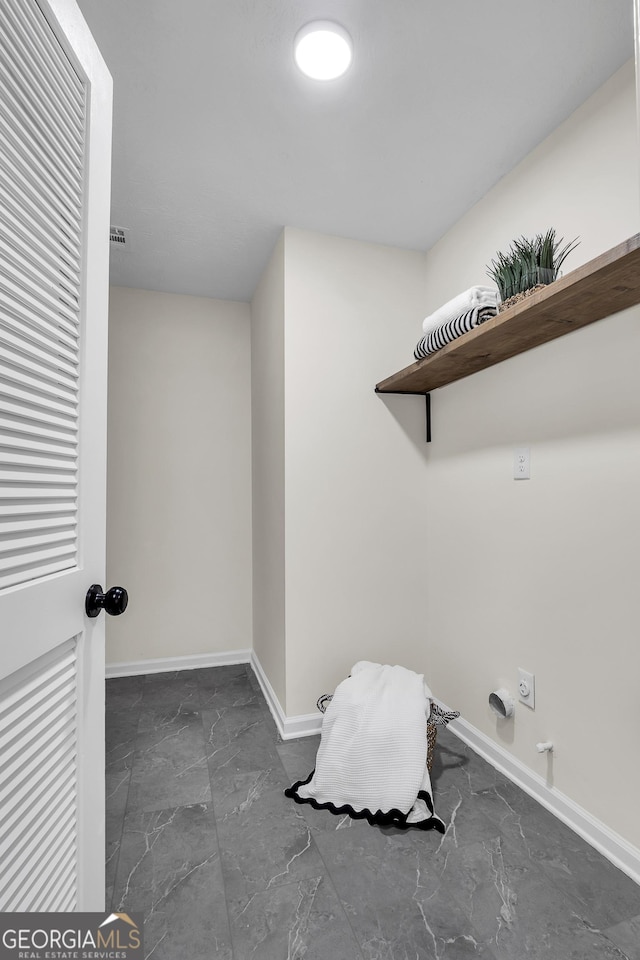 1075 Litchfield Way SW, Marietta, GA 30060 - washroom featuring marble look tile flooring, baseboards, and electric dryer hookup