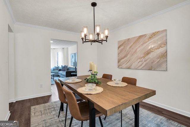 1075 Litchfield Way SW, Marietta, GA 30060 - dining space with wood finished floors, crown molding, baseboards, and a chandelier