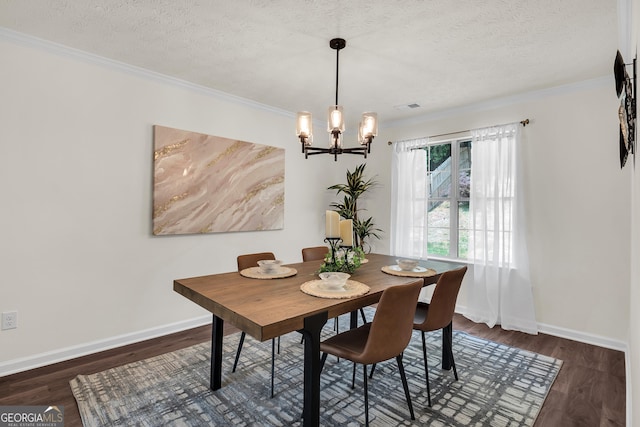 1075 Litchfield Way SW, Marietta, GA 30060 - dining space with a chandelier, dark wood-style flooring, ornamental molding, baseboards, and a textured ceiling