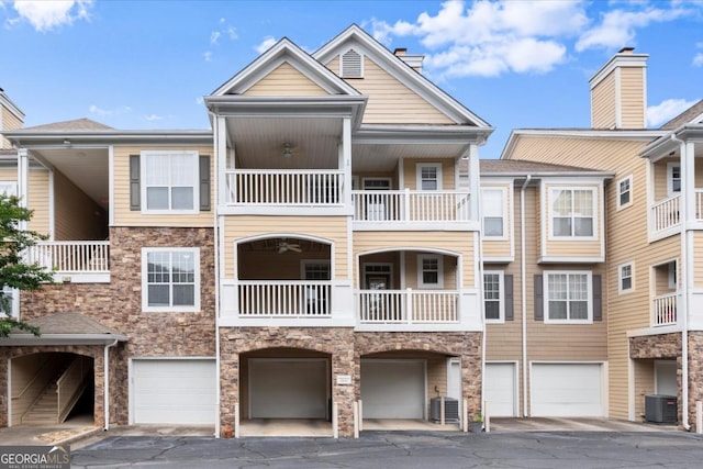 426 Pembrooke Cir Unit 426, Alpharetta, GA 30004 - view of building exterior with a garage and driveway