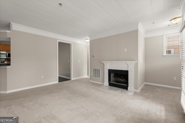 426 Pembrooke Cir Unit 426, Alpharetta, GA 30004 - unfurnished living room featuring ornamental molding, light carpet, and a fireplace with flush hearth