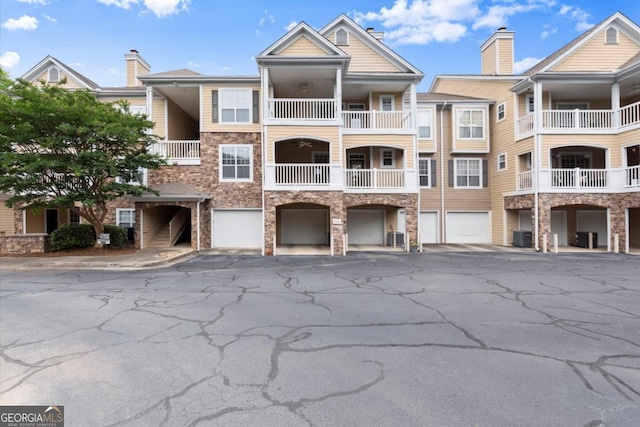 426 Pembrooke Cir Unit 426, Alpharetta, GA 30004 - view of property with a garage and driveway